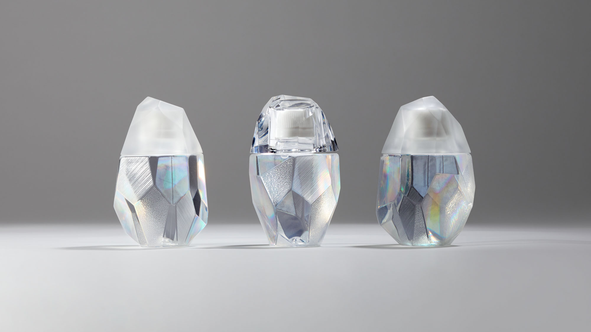 Functional film complex PET Bottle in multi-faceted sculptural forms, demonstrating high barrier protection and innovative bottle design.