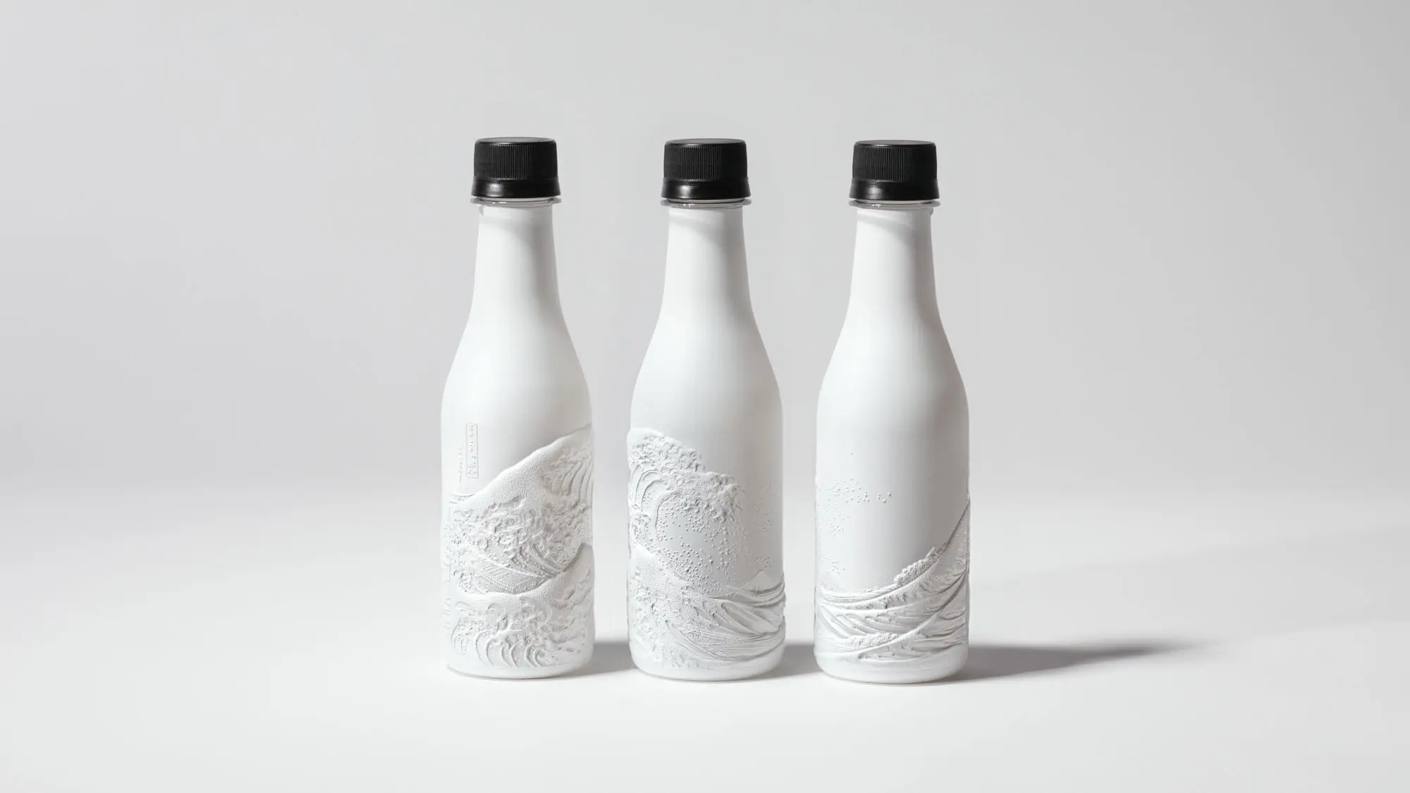 Functional film complex PET Bottle featuring a finely sculpted Hokusai ukiyo-e, combining high barrier performance with premium bottle design.
